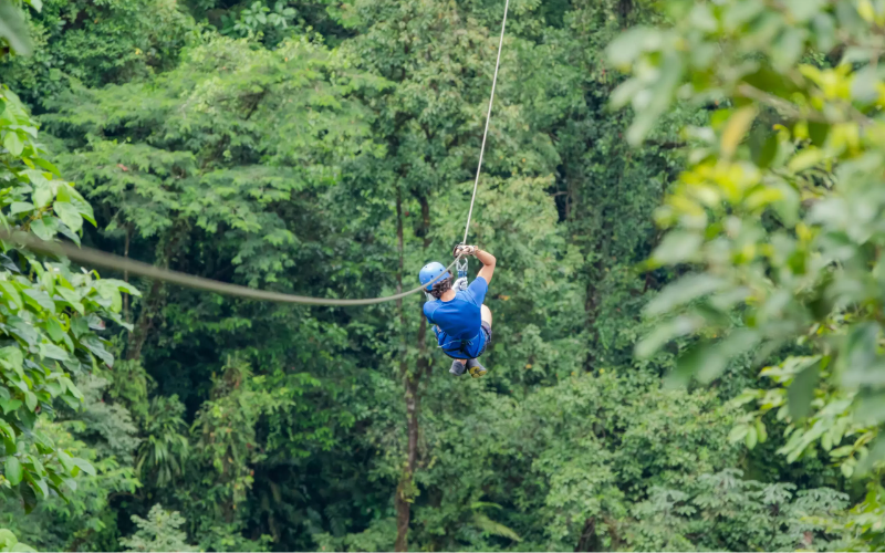 Ziplining with volcano backdrop